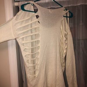White sweater with cuts in back